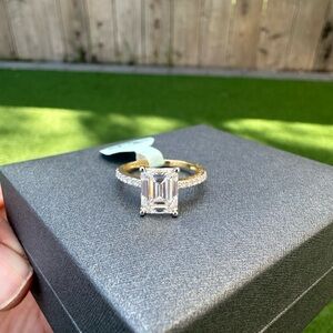 Emerald-Cut Solitaire Engagement Ring in Gold with Clear Stone